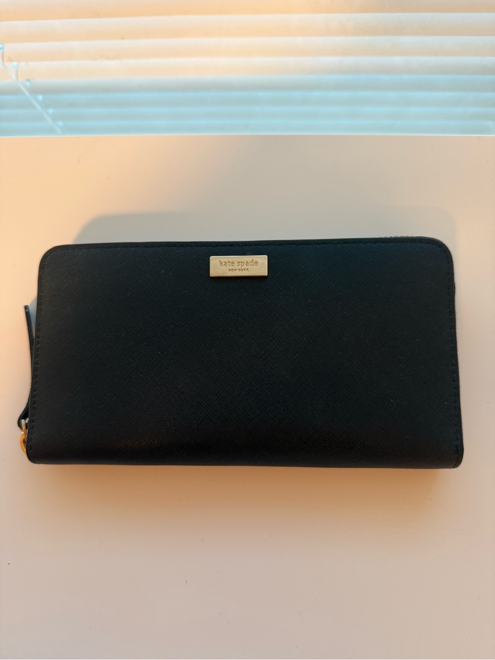kate spade Black Zip-Around Leather Wallet with Gold Plaque